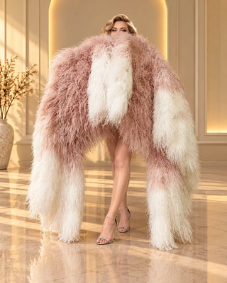 HOT FANS luxury gradient ostrich feather boa fans with long cascading blush pink and ivory white feathers surrounding a model.