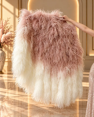 Side view of a luxury gradient waterfall boa fan with natural blush pink and ivory white ostrich feathers cascading downward.