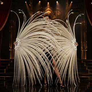 Grand Performance Huge Bleached Pheasant Tail Feather Fans in beige on a black and gold Art Deco stage