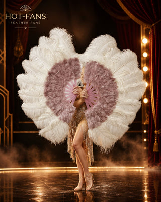 Luxury oversized bright red ostrich feather fans held by a burlesque showgirl on a black-and-gold cabaret stage, featuring realistic handmade feathers and pink-red staves by HOT-FANS / VIVA FEATHERS.