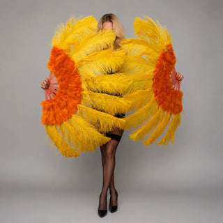 Yellow ostrich feather fan with orange marabou trim.