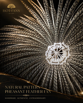 Close-up of an oversized pheasant feather fan showing natural black and ivory feather patterns and decorative staves by HOT-FANS